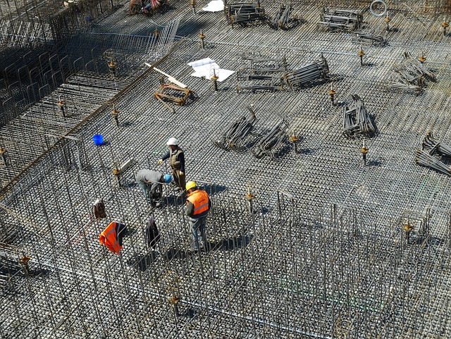 a group of construction workers are working on a construction site